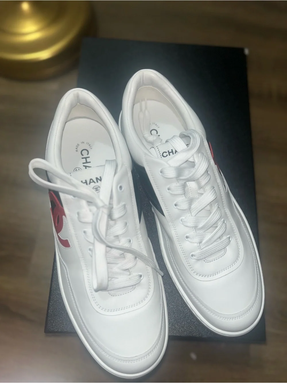 CHANEL White Leather Sneakers with Red CC and Black Panel